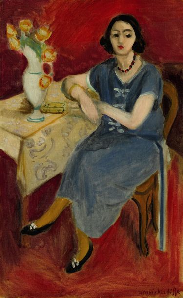 Woman in Blue at a Table, Red Background (1923).